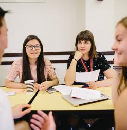 Participants engage in a discussion during class.