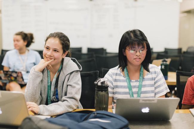 Two AI4ALL students on laptops in class